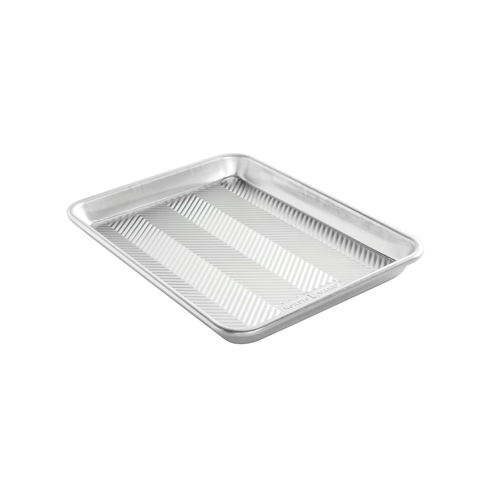 Nordic Ware Prism Quarter Sheet aluminum baking pan with textured bottom, rectangular with raised rim