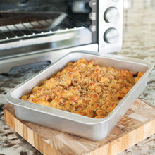 Golden baked macaroni and cheese casserole in Nordic Ware aluminum rectangular baker pan