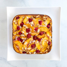 Square chocolate brownies with nuts baked in Nordic Ware aluminum springform pan, golden brown edges