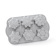 Nordic Ware aluminum snowflake cakelet pan with 6 individual detailed snowflake-shaped cavities, natural finish