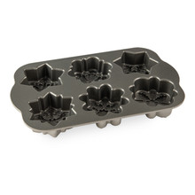 Nordic Ware aluminum cakelet pan with 6 individual snowflake-shaped cavities, gray nonstick interior coating