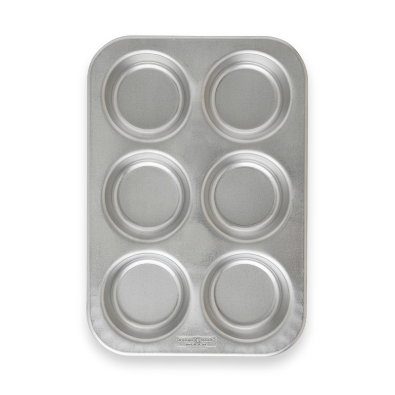 Nordic Ware Naturals aluminum jumbo muffin pan with 6 large cavities, natural silver finish, overhead view