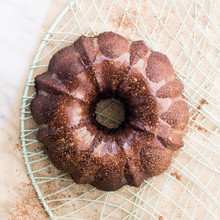 Nordic Ware aluminum 6-cup Anniversary bundt pan with intricate fluted design, natural silver finish