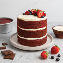 three layer frosted cake with strawberries baked with nordic ware 6in round layer cake pan