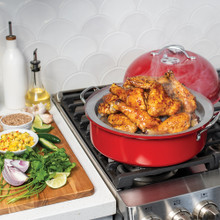 Indoor/Outdoor Kettle Smoker on stovetop with smoked chicken and veggies on side.