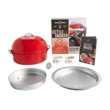 complete kettle smoker set staged with box pan inserts, smoker chips, thermometer, and booklet on white background