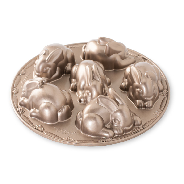 Nordic Ware aluminum baby bunny cake pan with six bunny-shaped cavities, cast aluminum with natural finish
