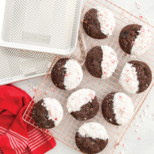 Baked chocolate chip cookies on wire cooling rack with two Nordic Ware Prism aluminum baking sheets, natural finish