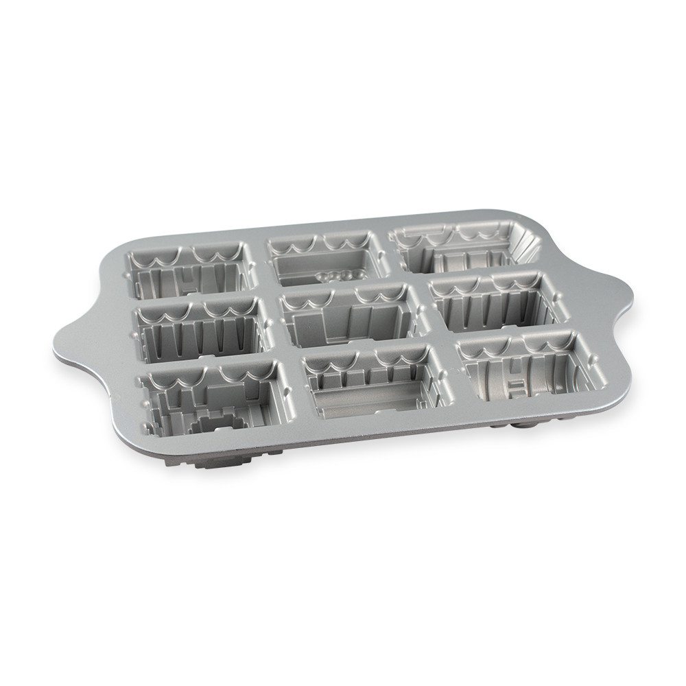 Nordic Ware aluminum train cake pan interior view, detailed locomotive compartments with non-stick surface