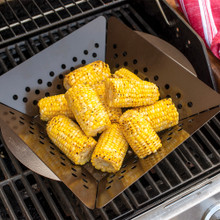 Grill Basket filled with corn cobs, on grill