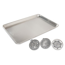 Nordic Ware Starry Night cookie stamp set with three circular stamps featuring star, moon, and celestial designs plus aluminum half sheet pan