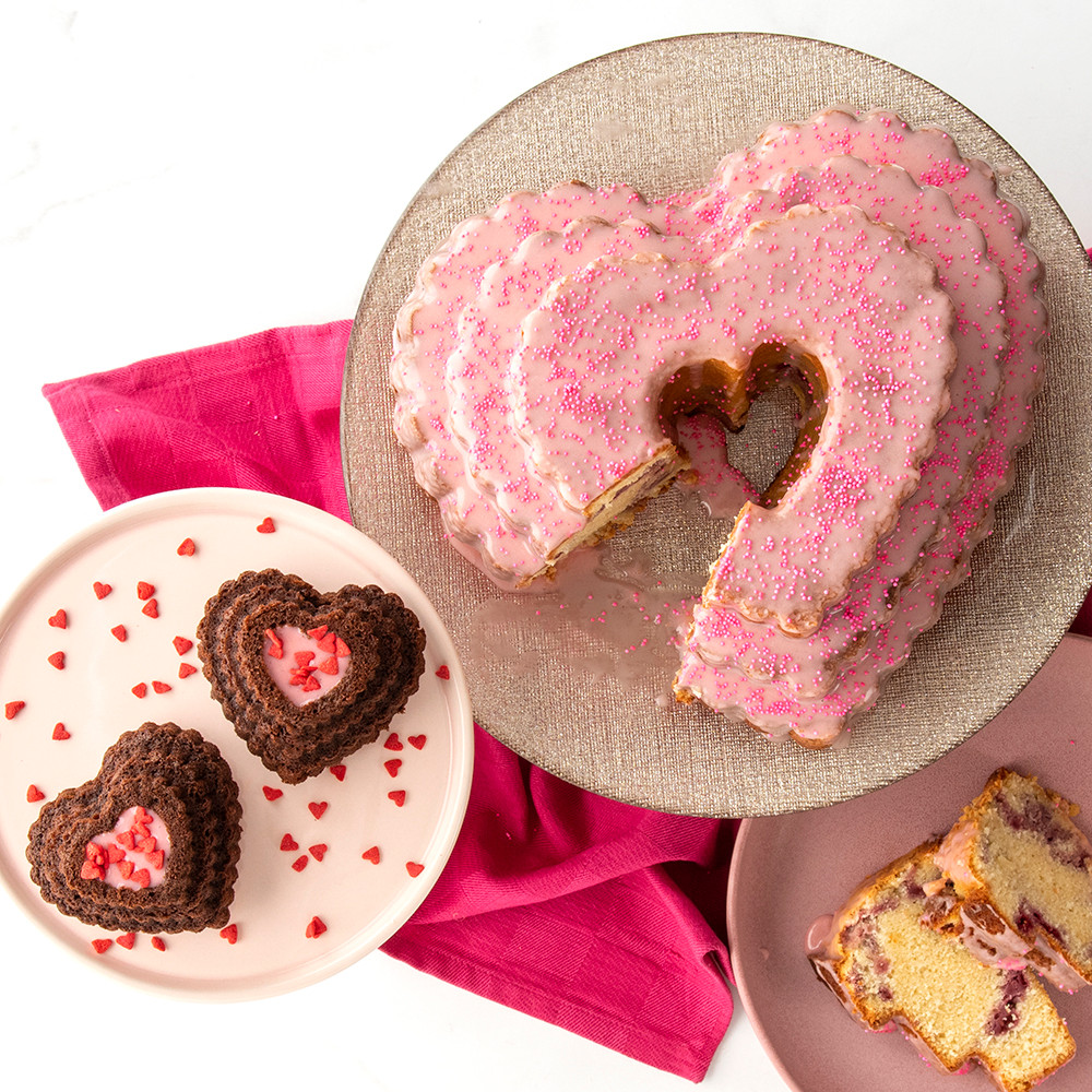 Pink frosted chocolate heart bundt cake and mini heart cakelets from Nordic Ware tiered heart pan, Valentine's display