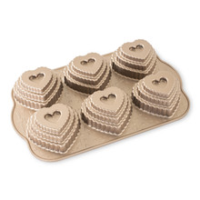 Nordic Ware aluminum tiered heart cakelet pan with 6 cavities, bronze non-stick coating, detailed scalloped design