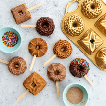 Mini bundt cakes on wooden sticks with Nordic Ware gold aluminum Geo Bundtlette pan, geometric patterns