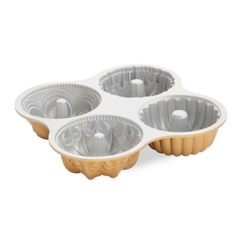 Nordic Ware aluminum Bundt Quartet pan with four connected mini bundt molds, gold exterior, silver nonstick interior