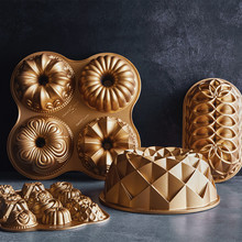 Nordic Ware gold aluminum bundt pans collection featuring Quartet pan with four mini designs and geometric bundt molds