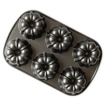 Nordic Ware aluminum Bundtlette pan with six fluted mini bundt cake molds, dark nonstick finish