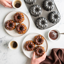 chocolate covered buntlette cakes made with nordic ware classic bundtlette cake pan