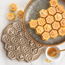 Golden hexagonal cake pieces in Nordic Ware aluminum honeycomb pull-apart pan with bronze coating
