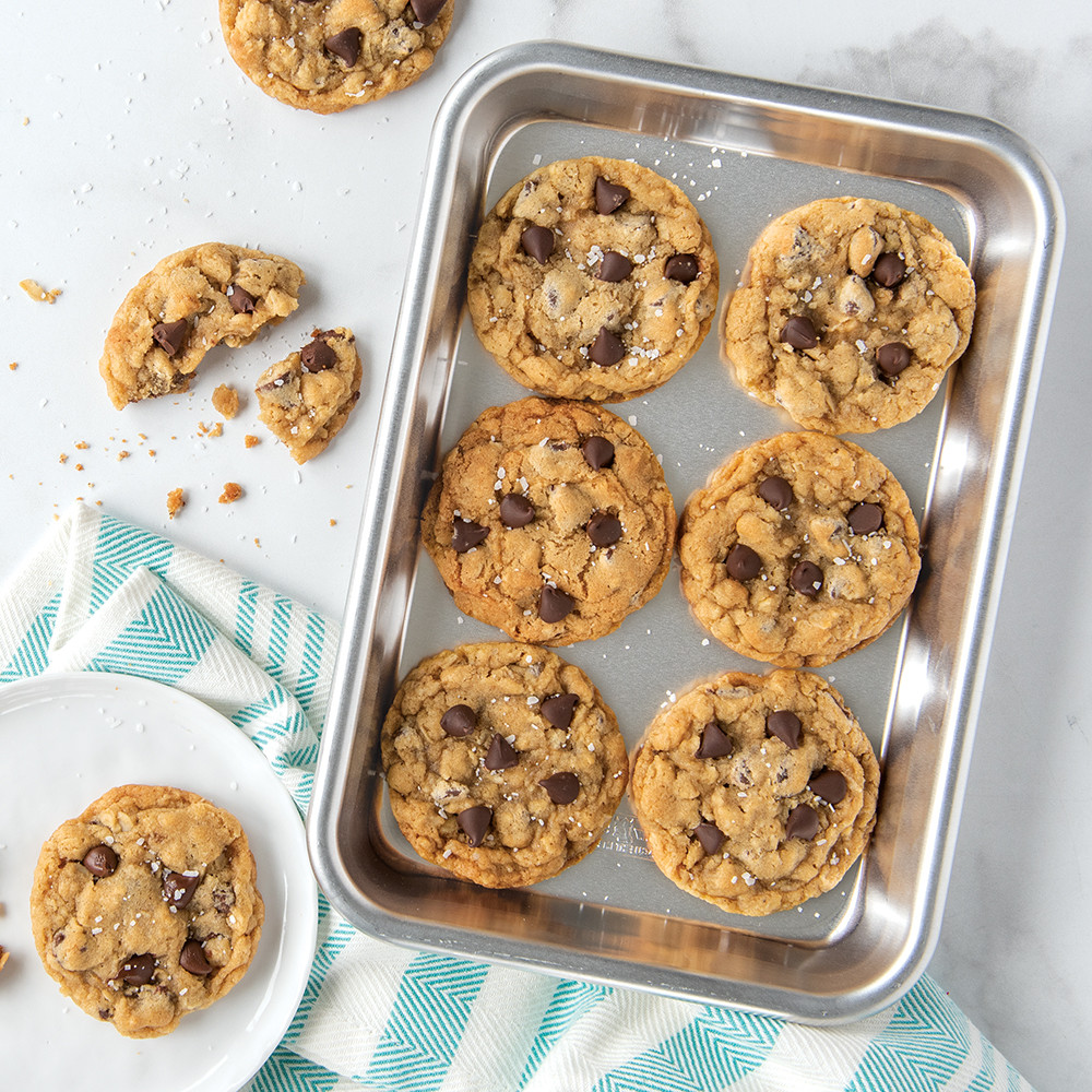 Golden chocolate chip cookies on Nordic Ware aluminum eighth sheet pan with natural silver finish