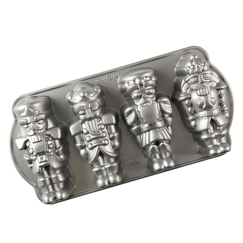 Nordic Ware aluminum cakelet pan with four detailed nutcracker soldier cavities, silver finish