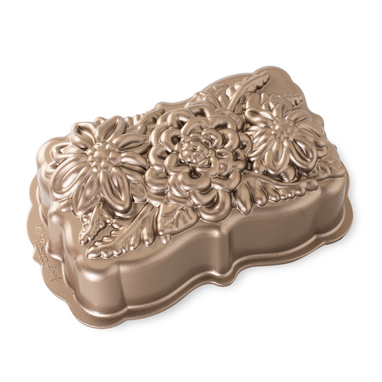 Nordic Ware aluminum wildflower loaf pan with detailed floral relief pattern, bronze-toned finish