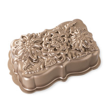 Nordic Ware aluminum wildflower loaf pan with detailed floral relief pattern, bronze-toned finish