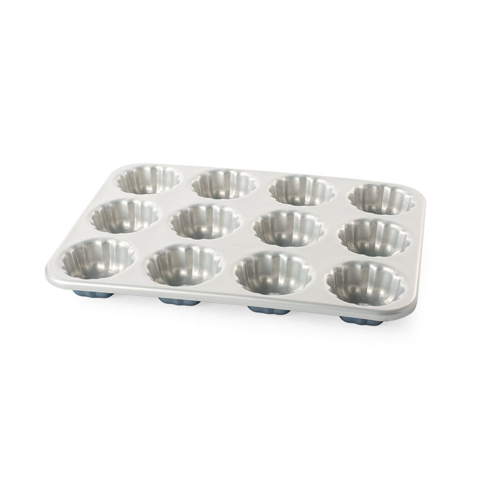 Nordic Ware aluminum mini bundt cupcake pan with 12 fluted cavities, twilight blue exterior, silver interior