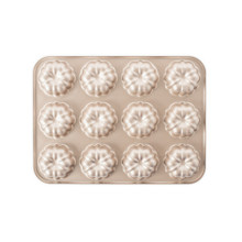 Nordic Ware aluminum mini bundt cupcake pan with 12 fluted cavities, champagne gold nonstick finish