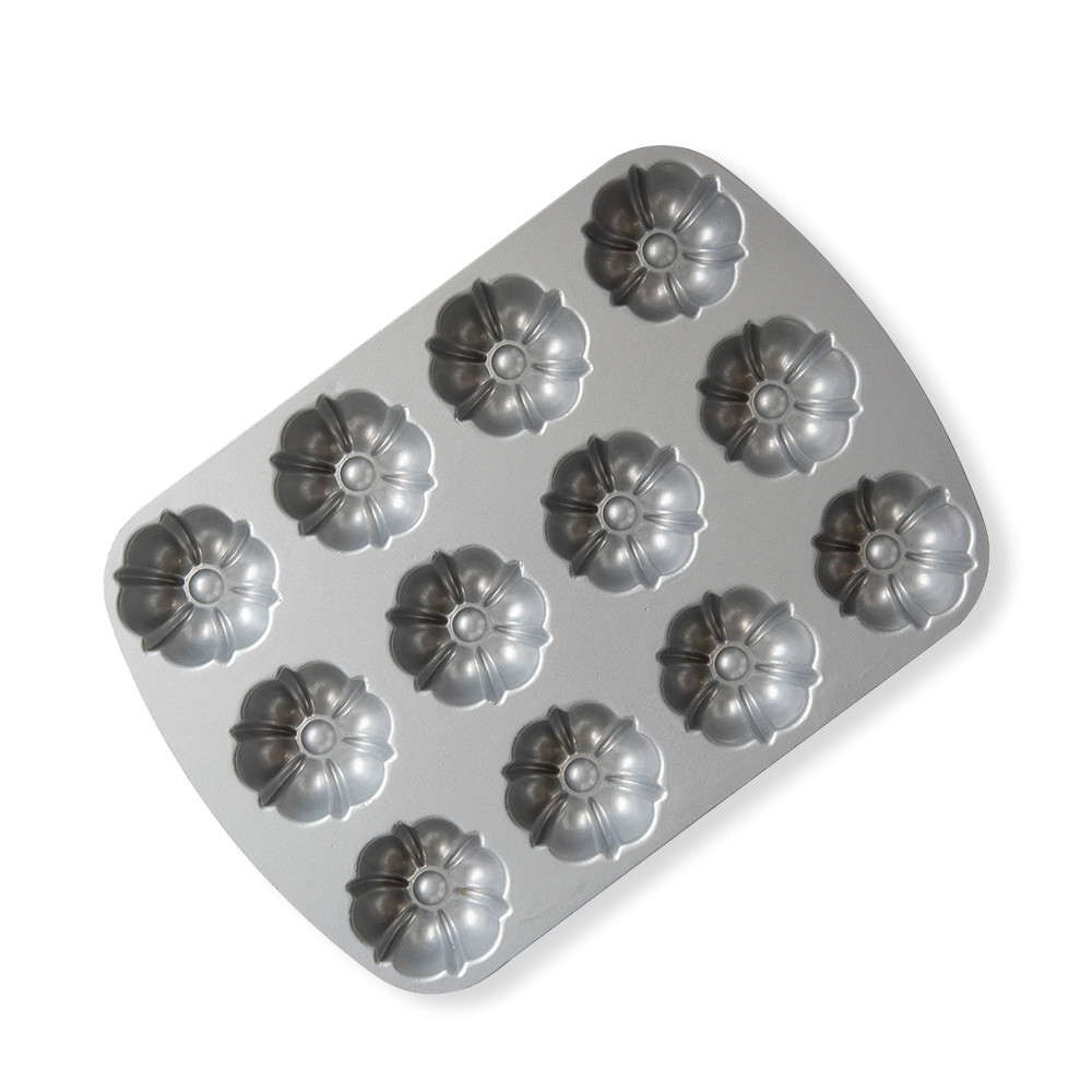 Nordic Ware aluminum bundt brownie pan with 12 mini fluted cavities, silver finish, rectangular shape