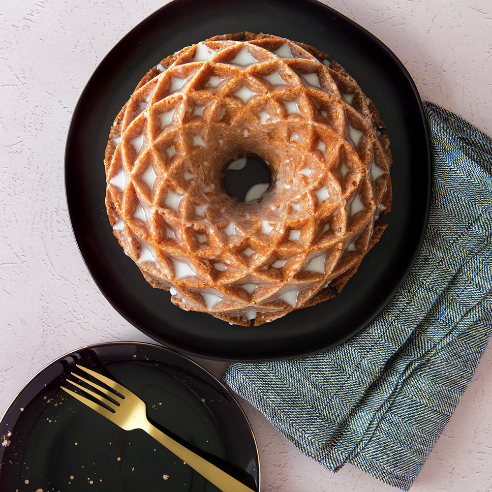 Golden glazed bundt cake with intricate diamond lattice pattern from Nordic Ware Jubilee bundt pan
