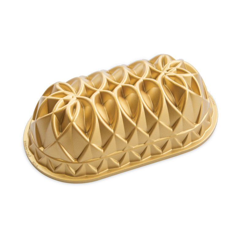 Nordic Ware Jubilee loaf pan, aluminum with gold finish, featuring decorative geometric diamond pattern design