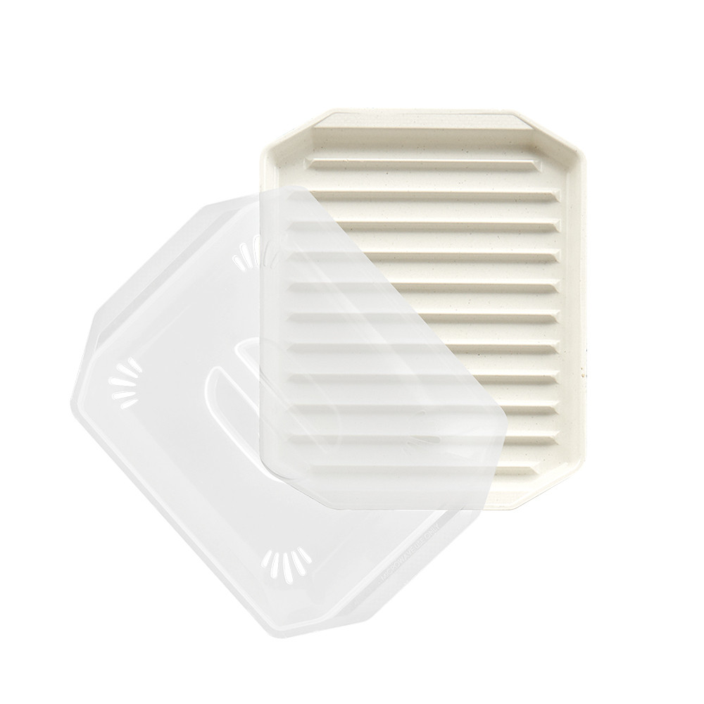Nordic Ware compact bacon tray with clear plastic lid, cream-colored base with ridged cooking surface