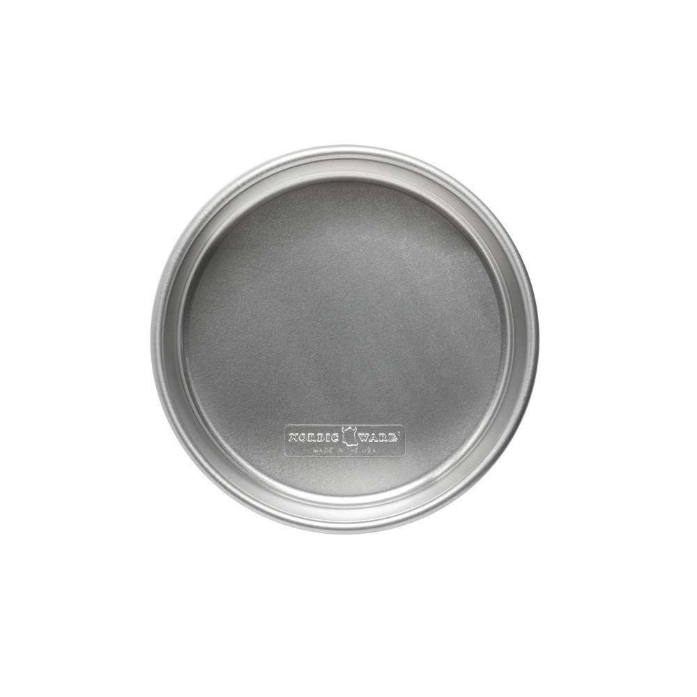 Nordic Ware Naturals 8-inch round aluminum layer cake pan with natural silver finish and raised rim