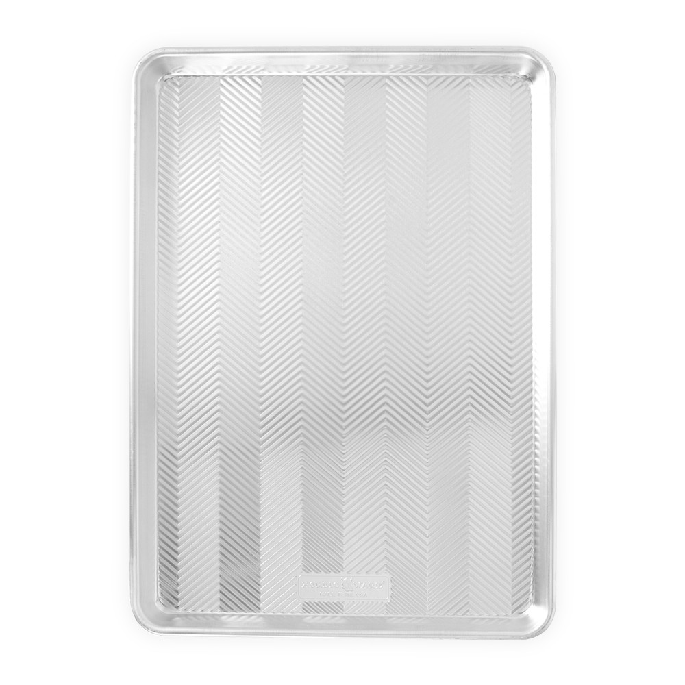 Nordic Ware Prism Big Sheet aluminum baking pan with textured chevron pattern and raised rim