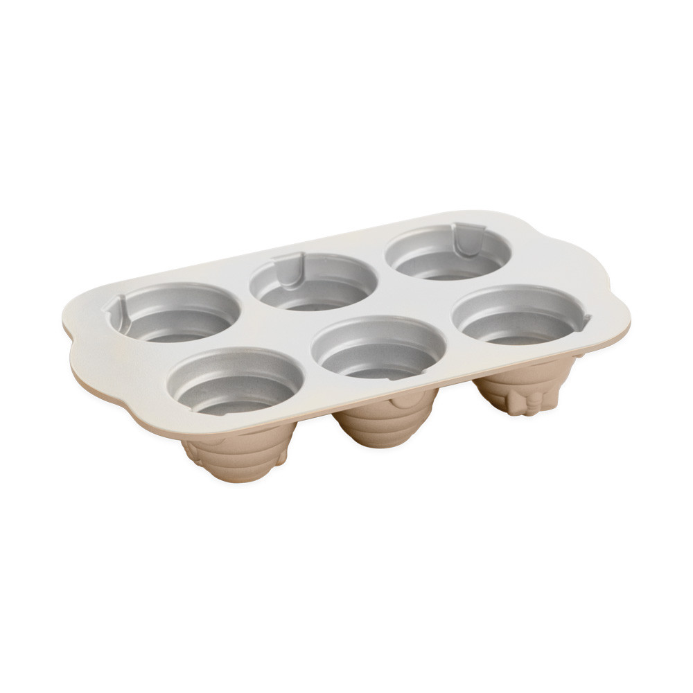 Nordic Ware toffee aluminum cakelet pan with six beehive-shaped molds, featuring ribbed dome design