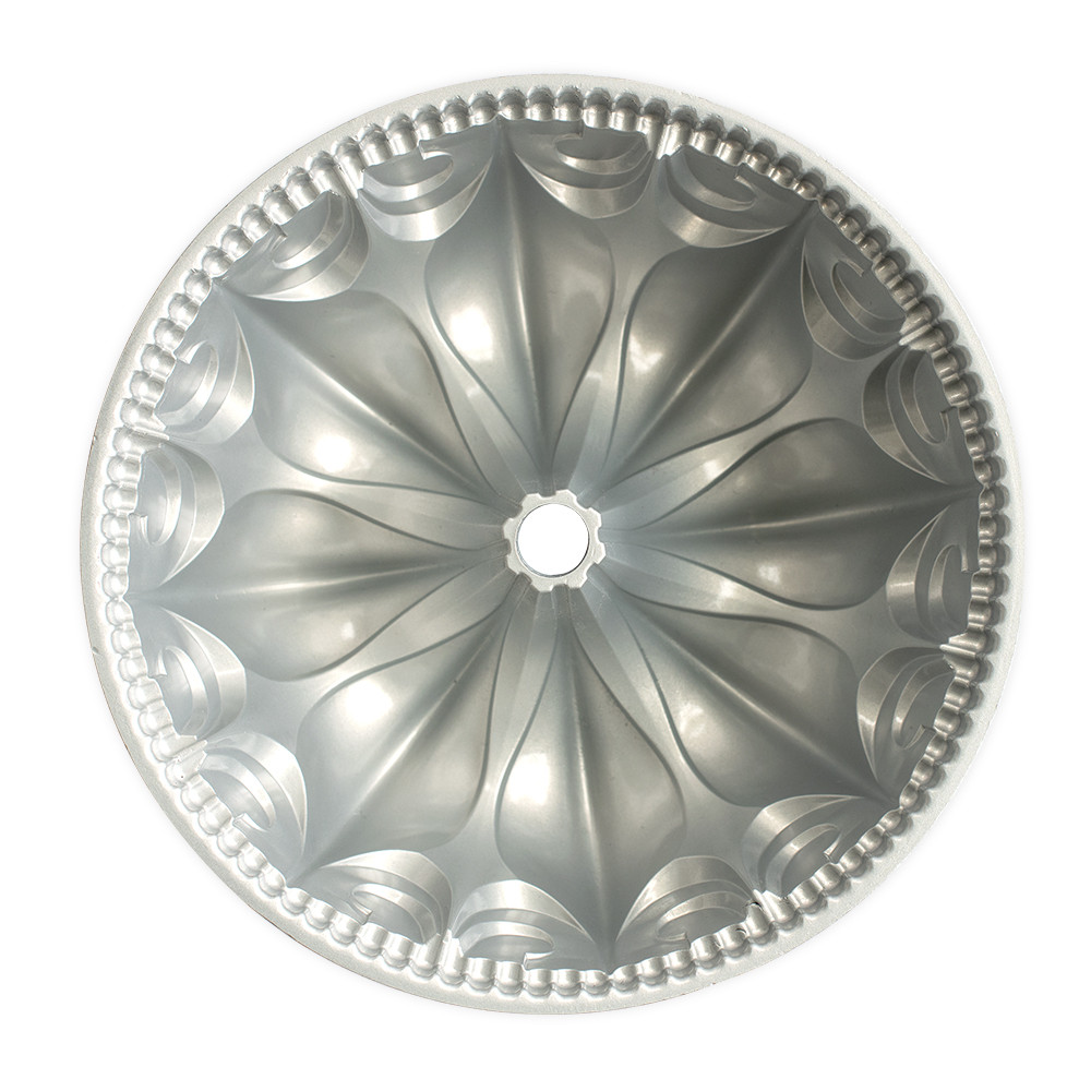 Nordic Ware aluminum Fleur De Lis bundt pan interior showing ornate fluted design with decorative rim