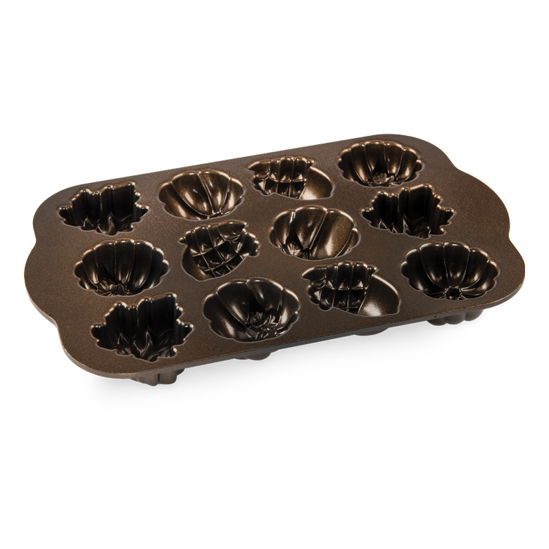 Nordic Ware aluminum cakelet pan with bronze nonstick coating, 12 cavities shaped like autumn leaves, acorns, and pumpkins