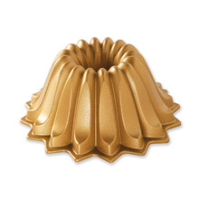 Nordic Ware Lotus bundt pan with decorative petal-shaped fluted design, gold aluminum finish