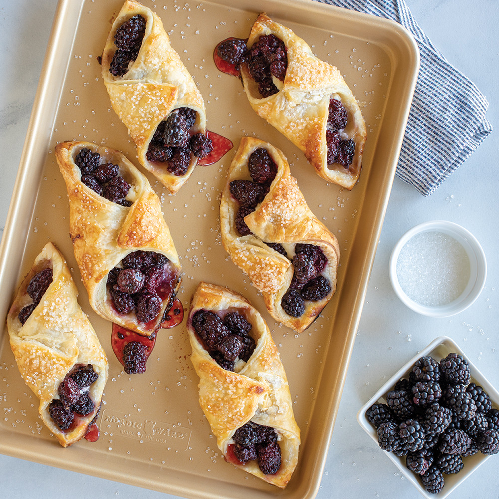Flaky pastries with berry filling baked on Nordic Ware aluminum nonstick jelly roll pan, golden brown