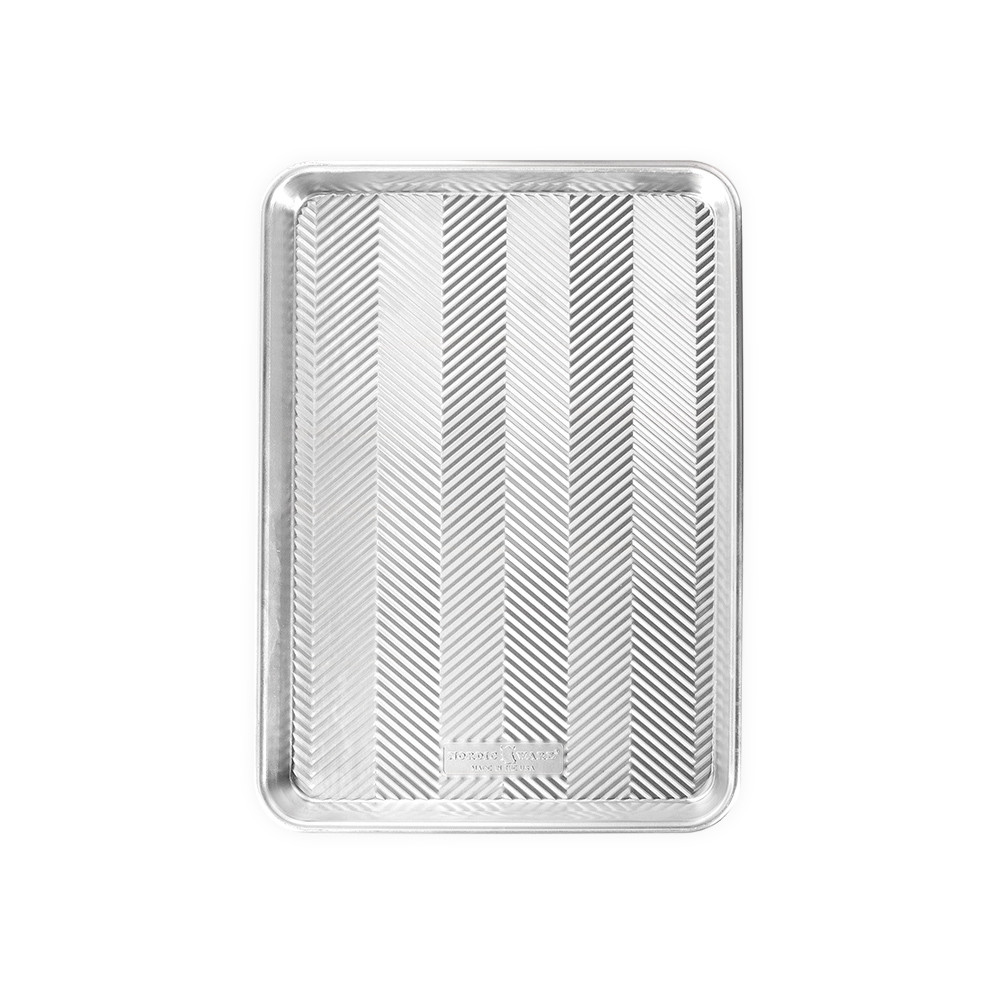 Nordic Ware aluminum Prism jelly roll pan with textured chevron pattern interior and raised rim