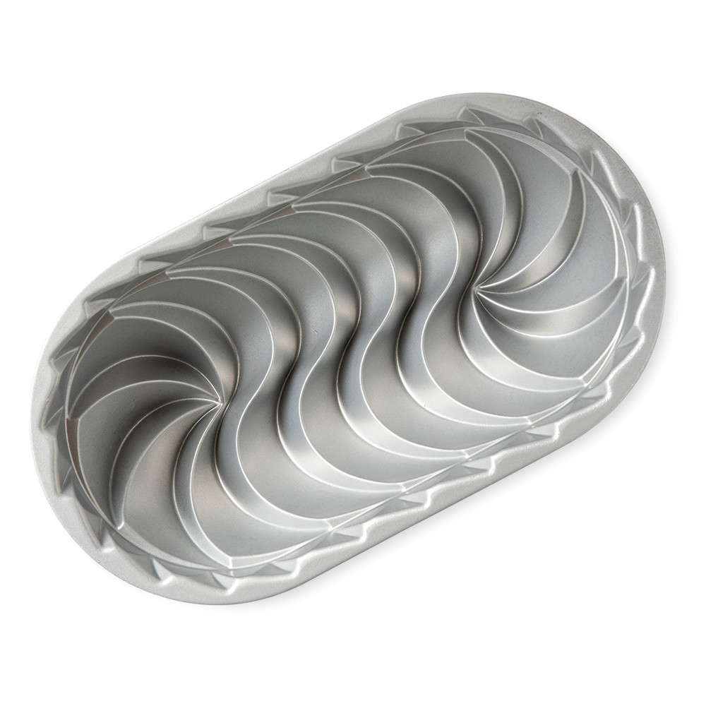 Nordic Ware Heritage aluminum loaf pan interior showing decorative swirl pattern, silver finish
