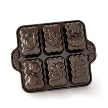 Nordic Ware bronze aluminum mini loaf pan with 6 cavities featuring harvest designs: acorn, turkey, pumpkin, leaves, and squirrel