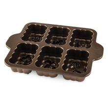 Nordic Ware Harvest Mini Loaf Pan with 6 cavities, bronze nonstick interior showing detailed leaf patterns