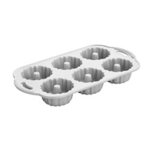 Nordic Ware Anniversary Bundtlette pan, aluminum mini bundt mold with decorative fluted design, silver finish