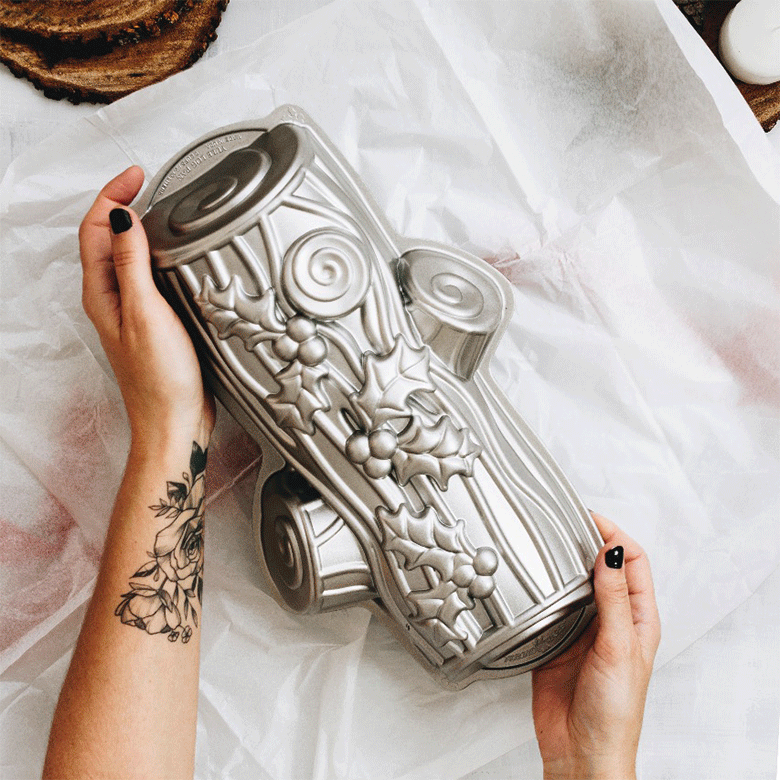 Animated unwrapping of Nordic Ware aluminum Buche de Noel yule log baking pan from festive gift wrapping