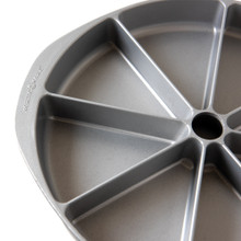 Nordic Ware aluminum scone and cornbread pan with 8 triangular wedge-shaped cavities, natural silver finish