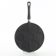 Nordic Ware aluminum silver dollar pancake pan with 7 round cavities and long handle, natural finish