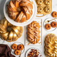 glazed bundt cake group baked and displayed with nordic ware braided bundt, braided loaf bundt, and braided bundtlette pans