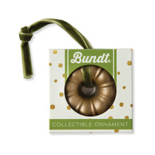 Nordic Ware gold cast aluminum Bundt pan ornament in clear plastic gift box packaging